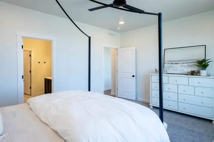 Bedroom featuring recessed lighting, a ceiling fan, and light-colored carpeting