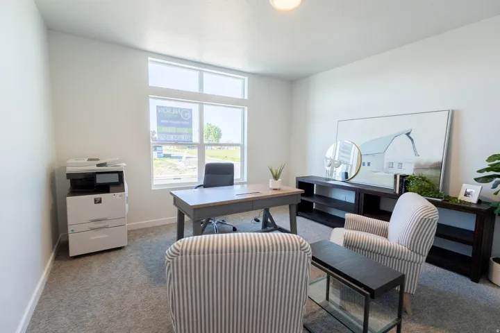 Bright room with light gray carpet and white walls