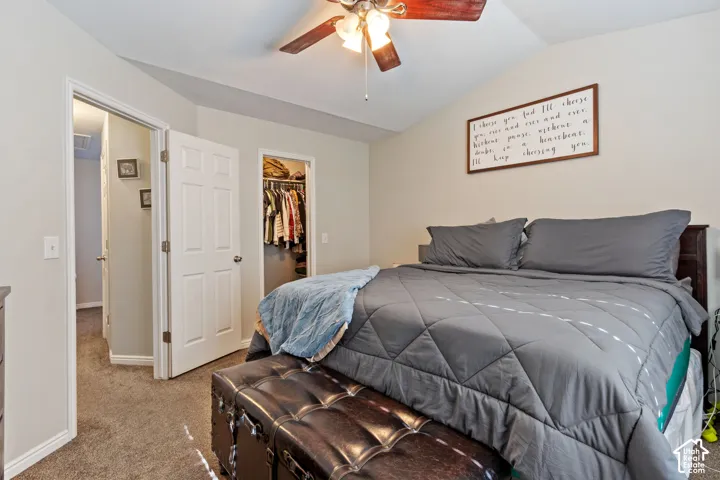 Bedroom featuring a vaulted ceiling and a ceiling fan with light fixture