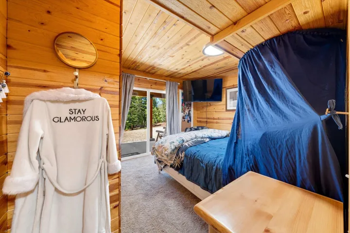 Wood-paneled interior with wood-finish flooring