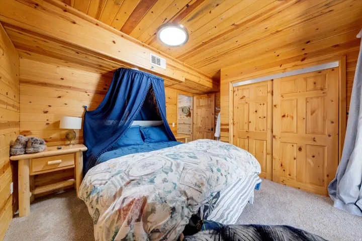 Knotty pine paneling adorns the walls and ceiling