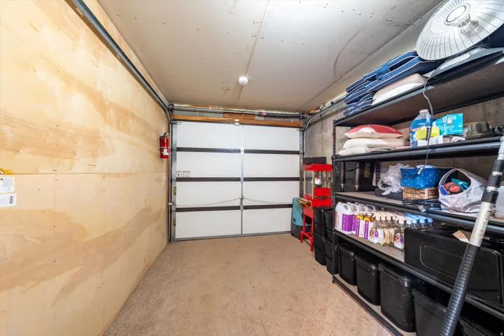 Attached garage with a segmented overhead door