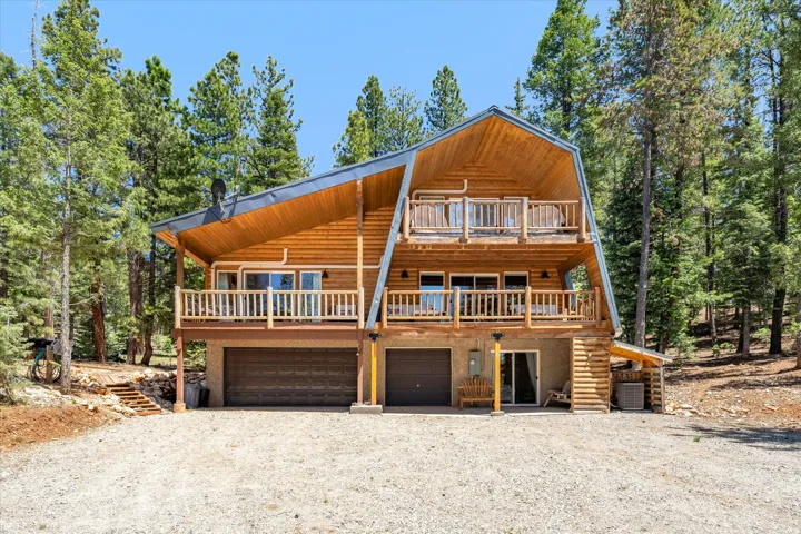 Multi-level wood-sided property with a distinctive gambrel roofline