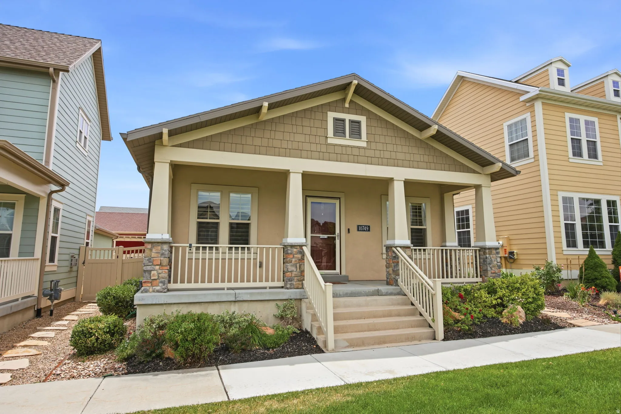 Craftsman-style facade featuring earth-toned siding and shake accents