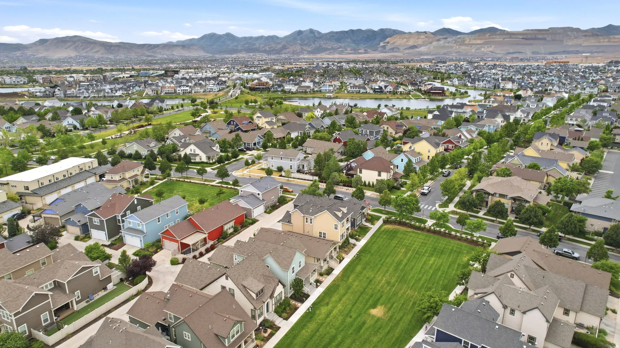 Expansive residential development featuring varied architectural styles and abundant green spaces