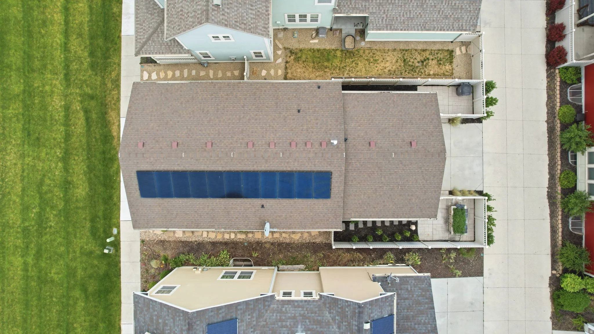 Brown shingle roof with integrated solar panels