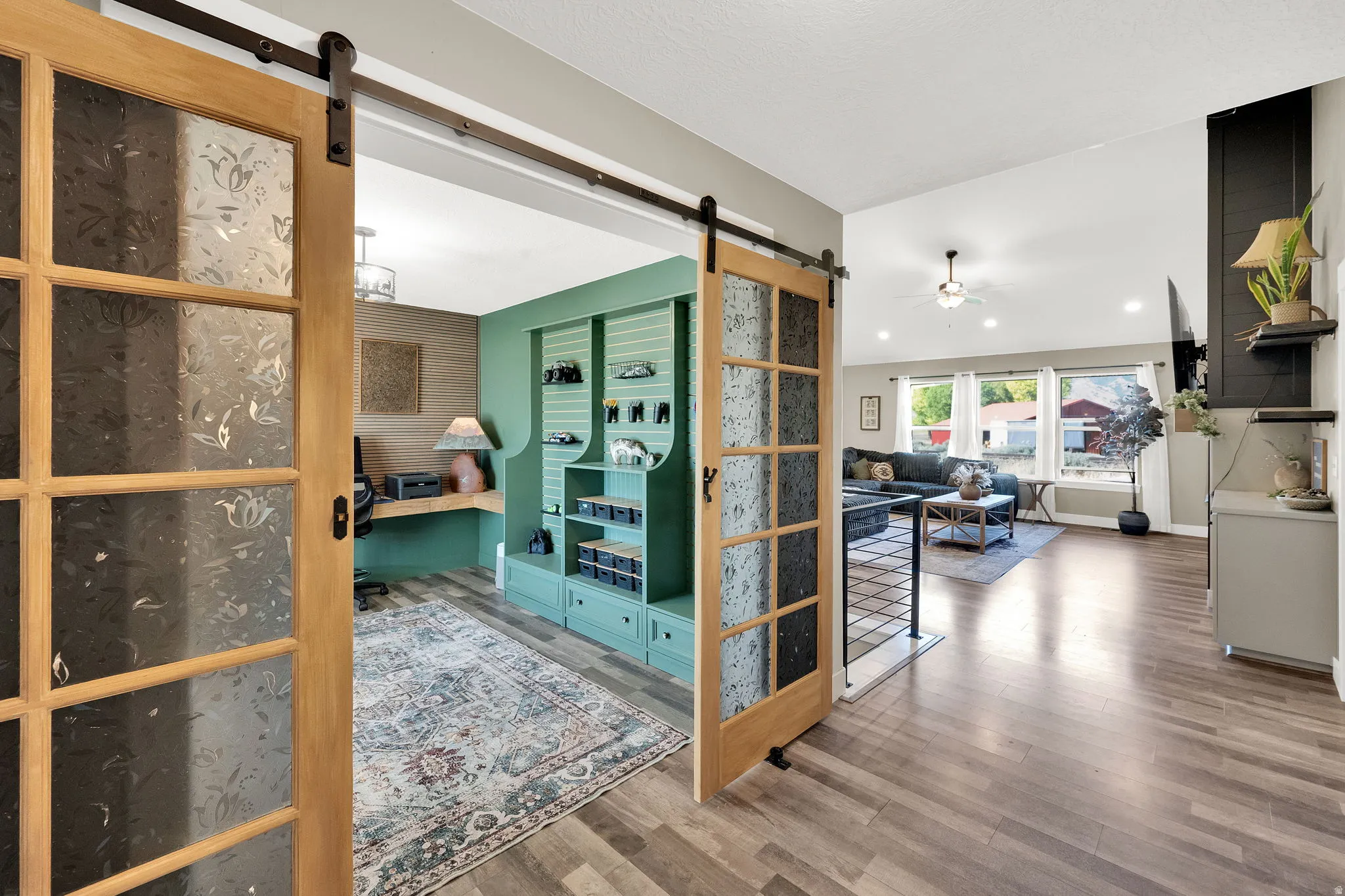 Barn door entry featuring frosted glass panels with a floral pattern