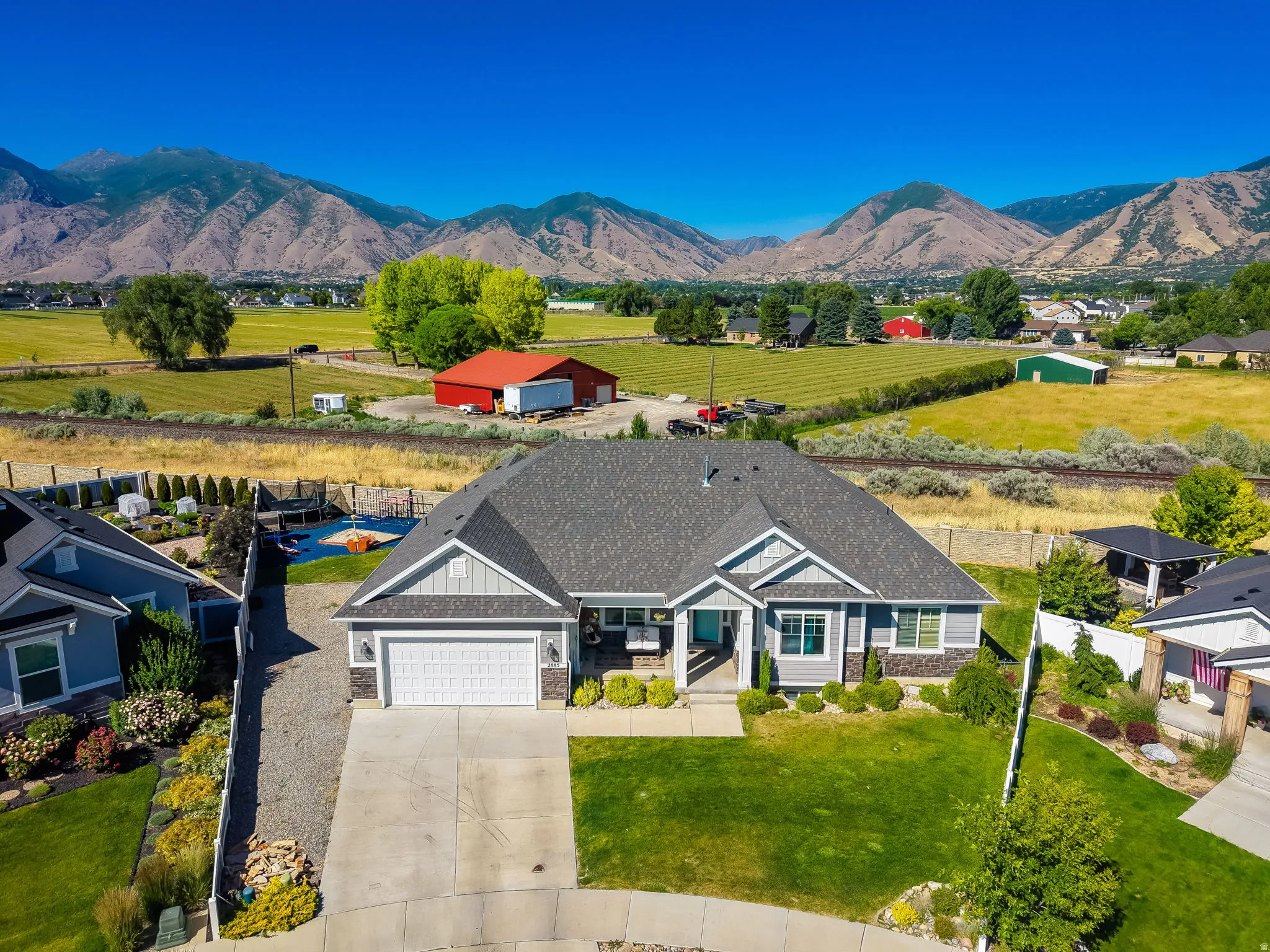Ranch-style residence featuring a prominent gabled roofline and attached two-car garage