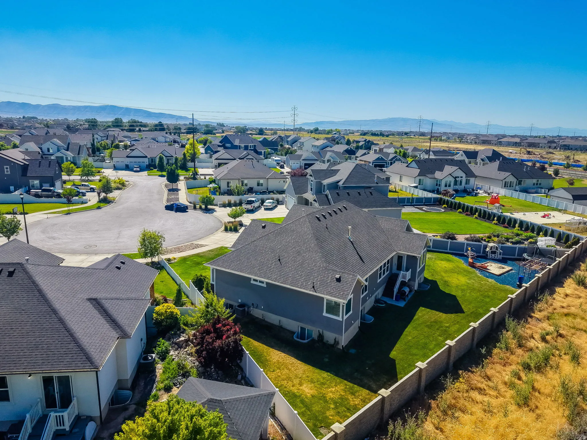 Aerial view highlighting a residential neighborhood with a cul-de-sac street