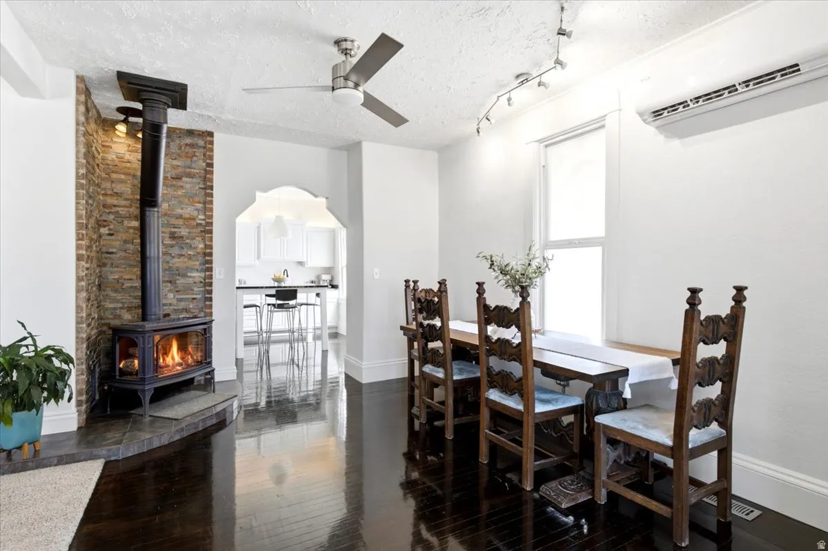 Dining area with Lopi cast iron natural gas stove with blower