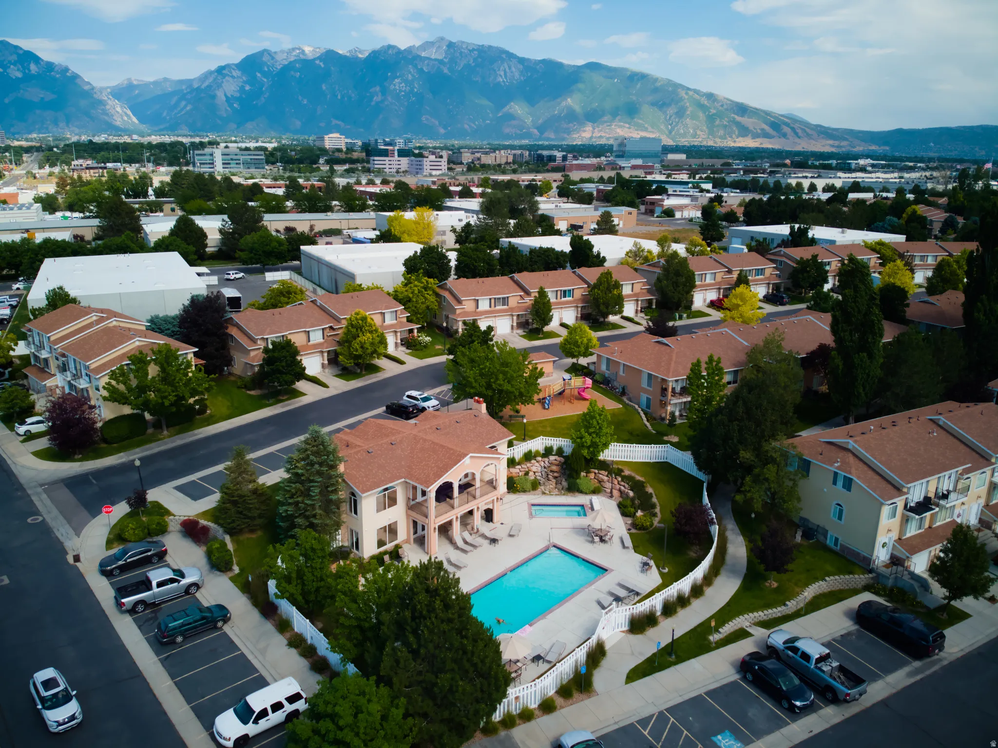 Community pool and spa with mountain backdrop