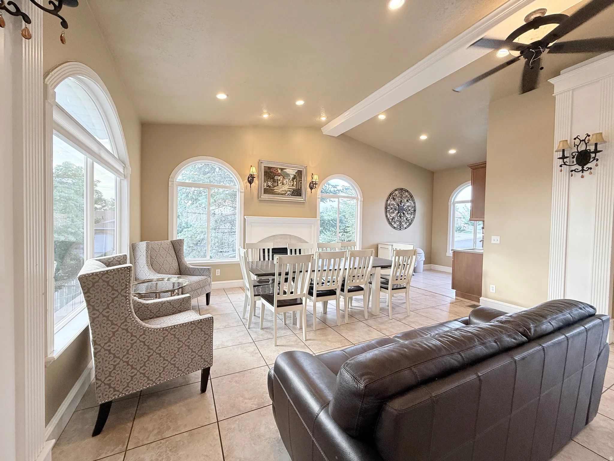 Vaulted ceiling with recessed lighting and a ceiling fan