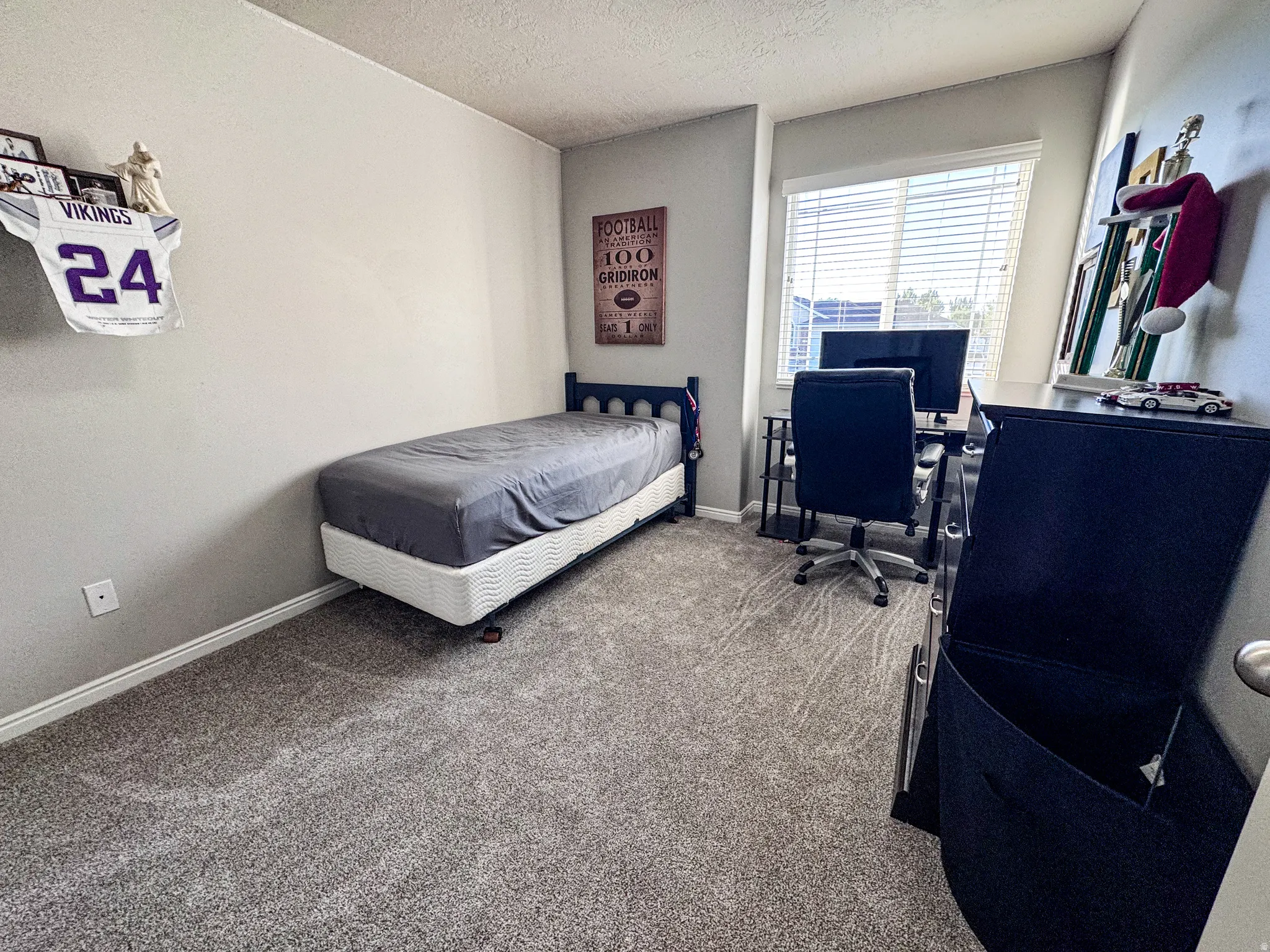 Light gray wall color with a single window featuring horizontal blinds