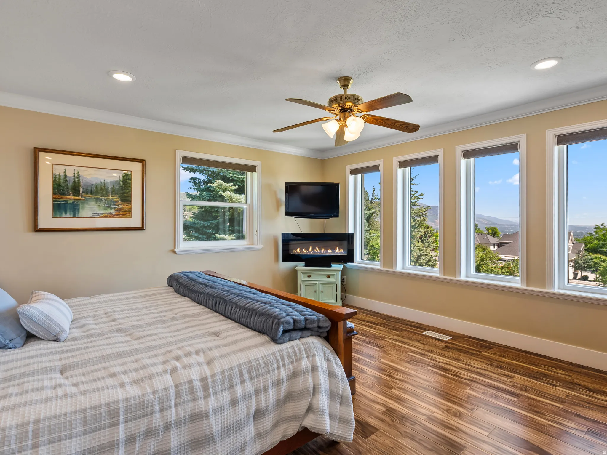 Bedroom with wood-finish flooring, recessed lighting, and a ceiling fan