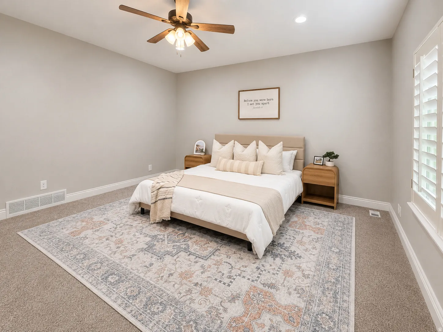 Carpeted room featuring a ceiling fan with integrated lighting, recessed lighting, and white plantation shutters