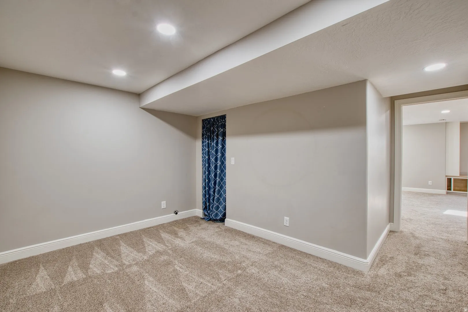 Carpeted room featuring recessed lighting and neutral wall tones