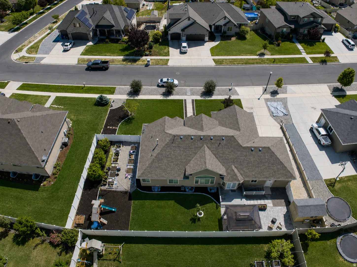 Expansive property featuring a large backyard, paved patio, and established landscaping