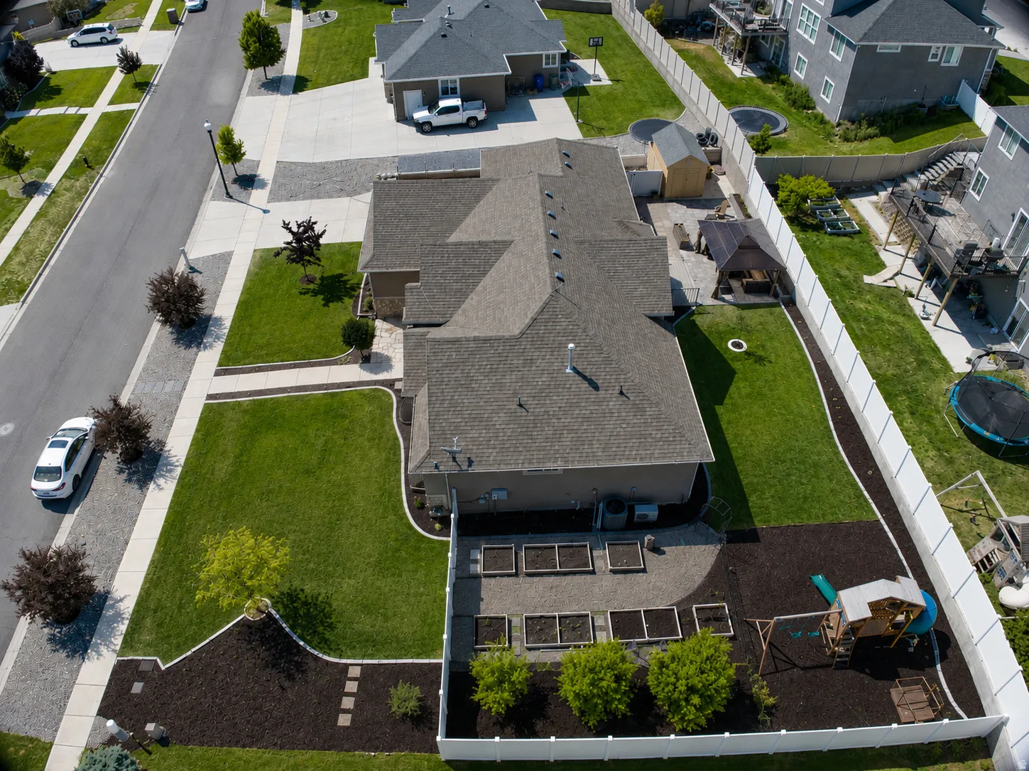 Aerial perspective showcasing a single-story residence with a multi-pitched roof