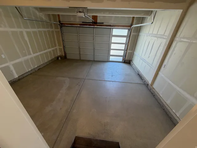Concrete flooring, automatic garage door opener, garage door with integrated windows