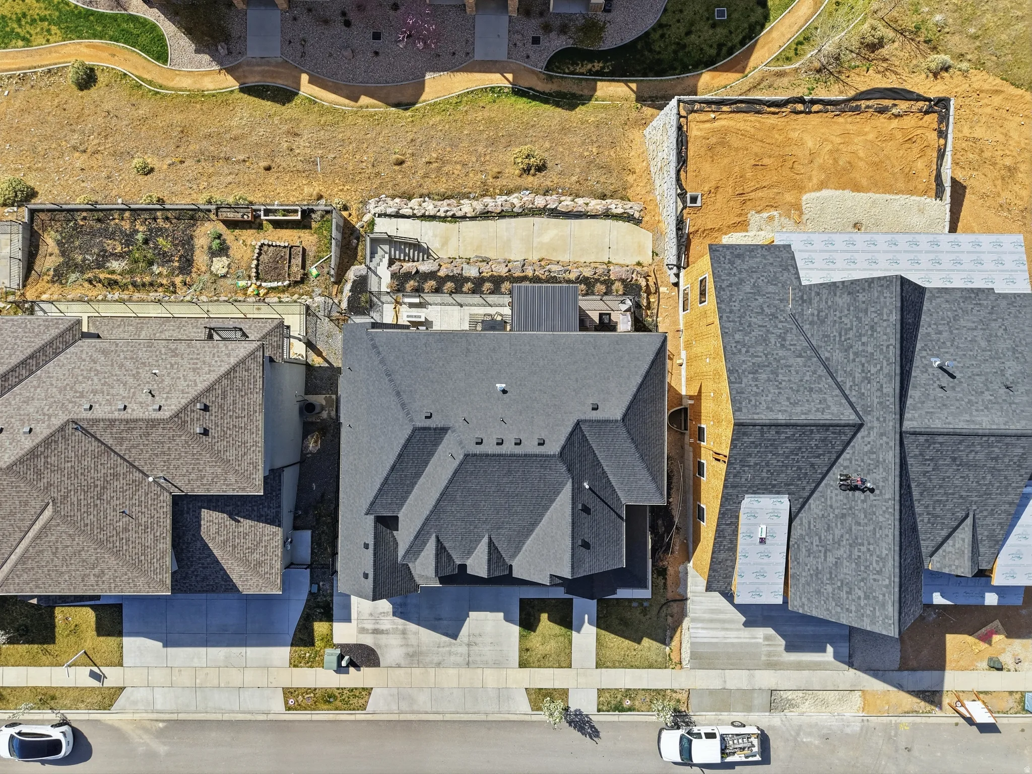 Contemporary residential property featuring a multi-gabled dark gray shingle roof