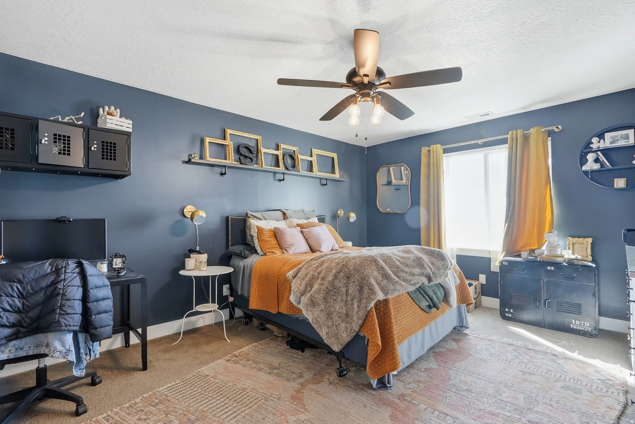Room featuring a ceiling fan, window with natural light, and ample wall space
