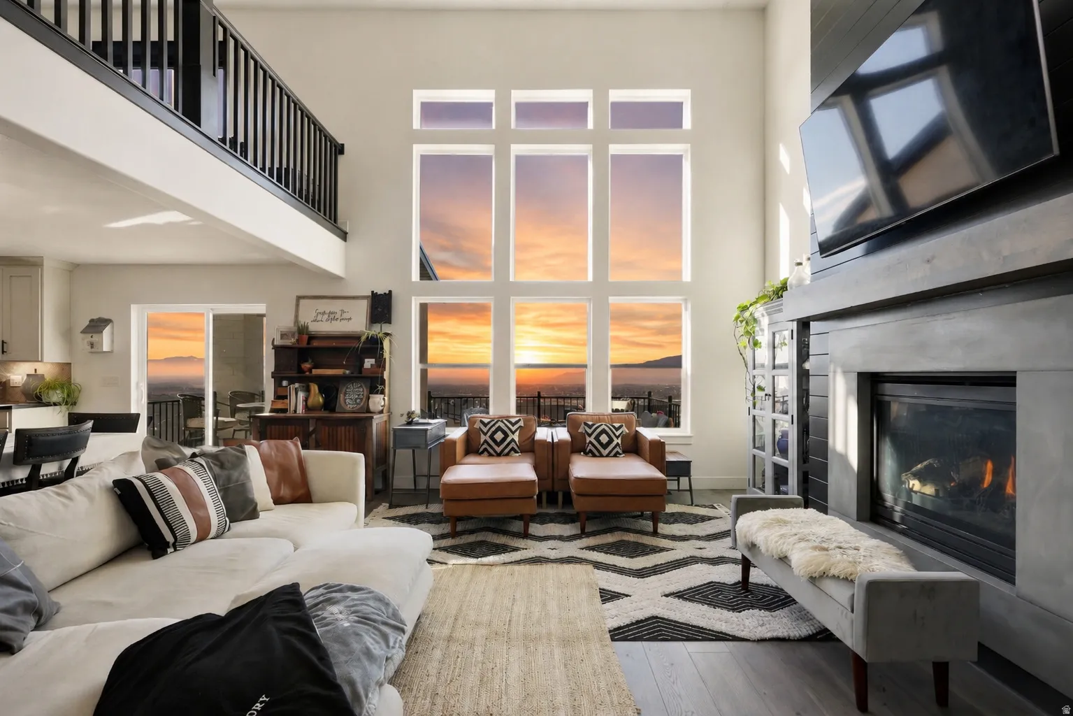 Vaulted living room featuring a floor-to-ceiling window wall with expansive scenery