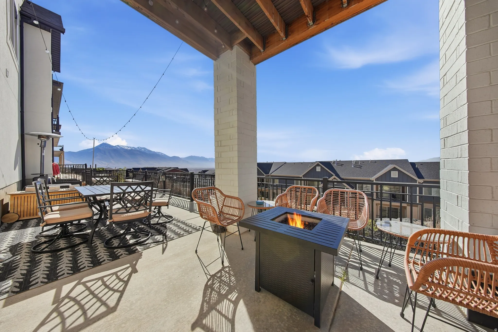 Covered outdoor patio with a concrete surface and a wood plank ceiling