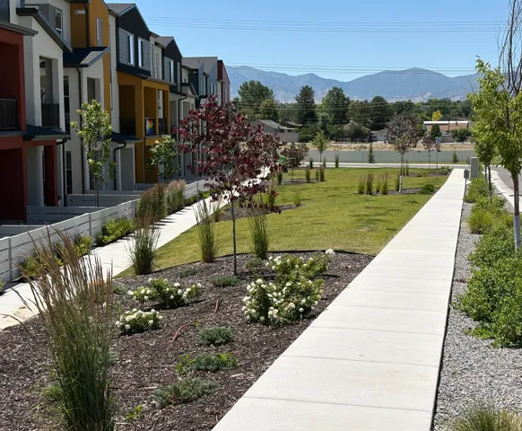 Contemporary townhome exteriors featuring varied color palettes and private balconies