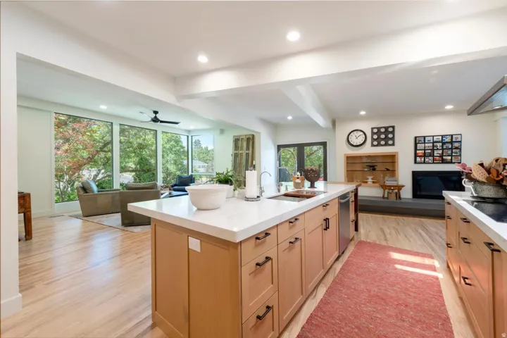 Spacious kitchen island with a white countertop and wood-finish cabinetry