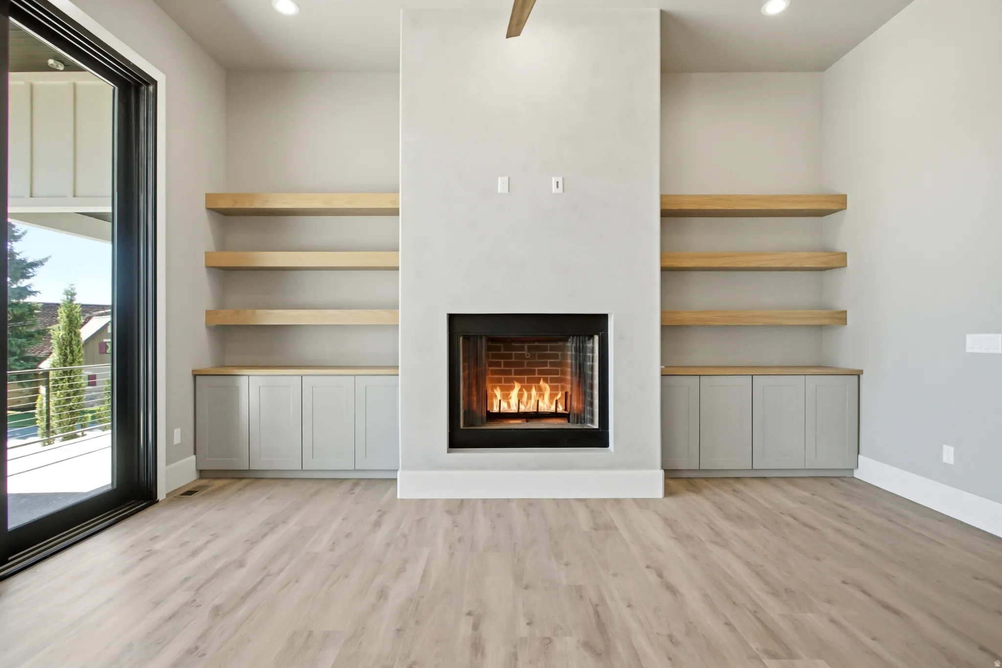 Contemporary fireplace with a brick firebox and black surround