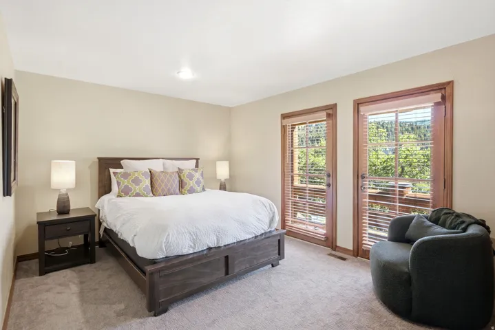 Bedroom featuring neutral-toned walls and plush carpet flooring