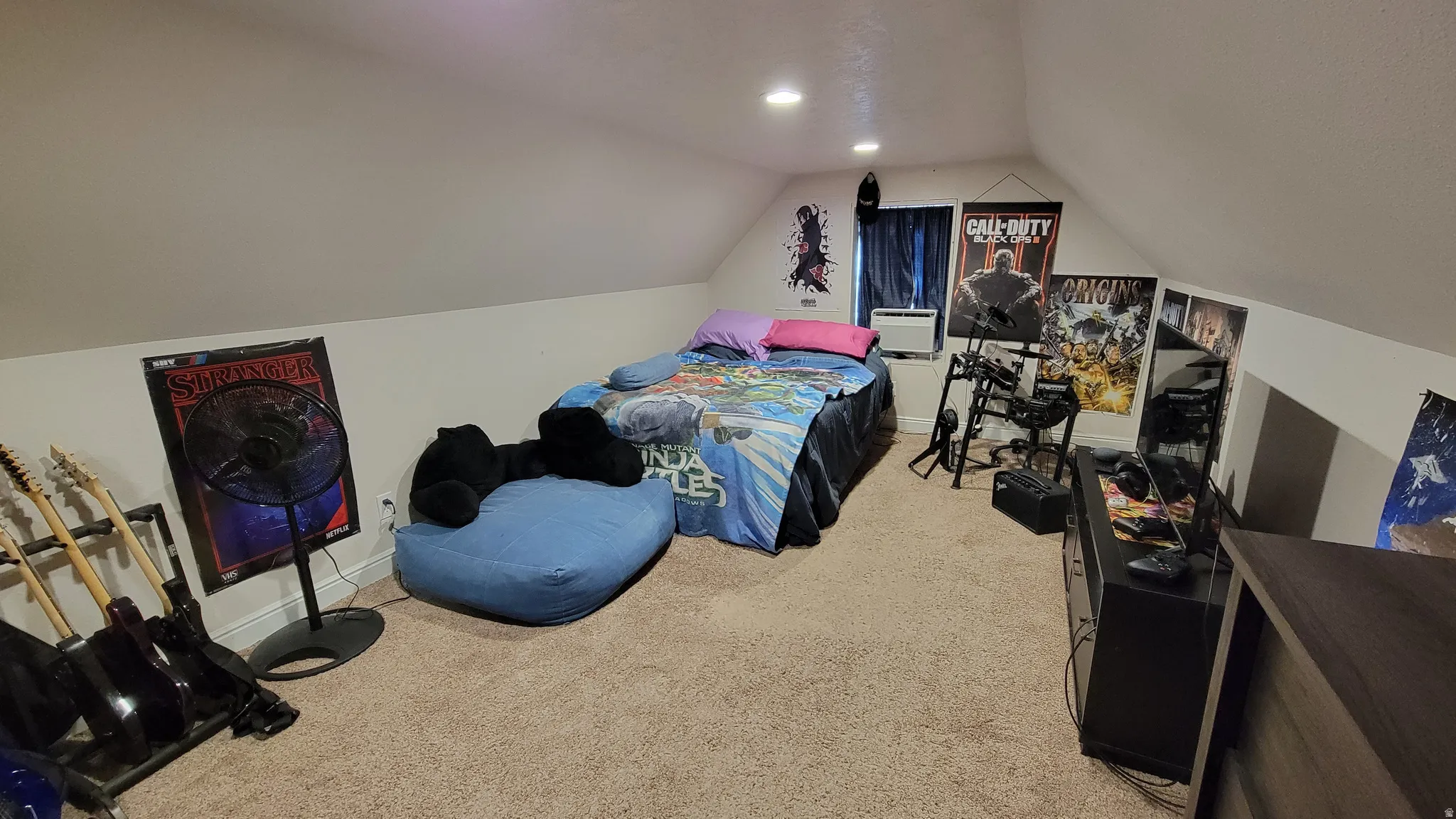 Carpeted room featuring sloped ceilings, recessed lighting, and a window with dark blinds