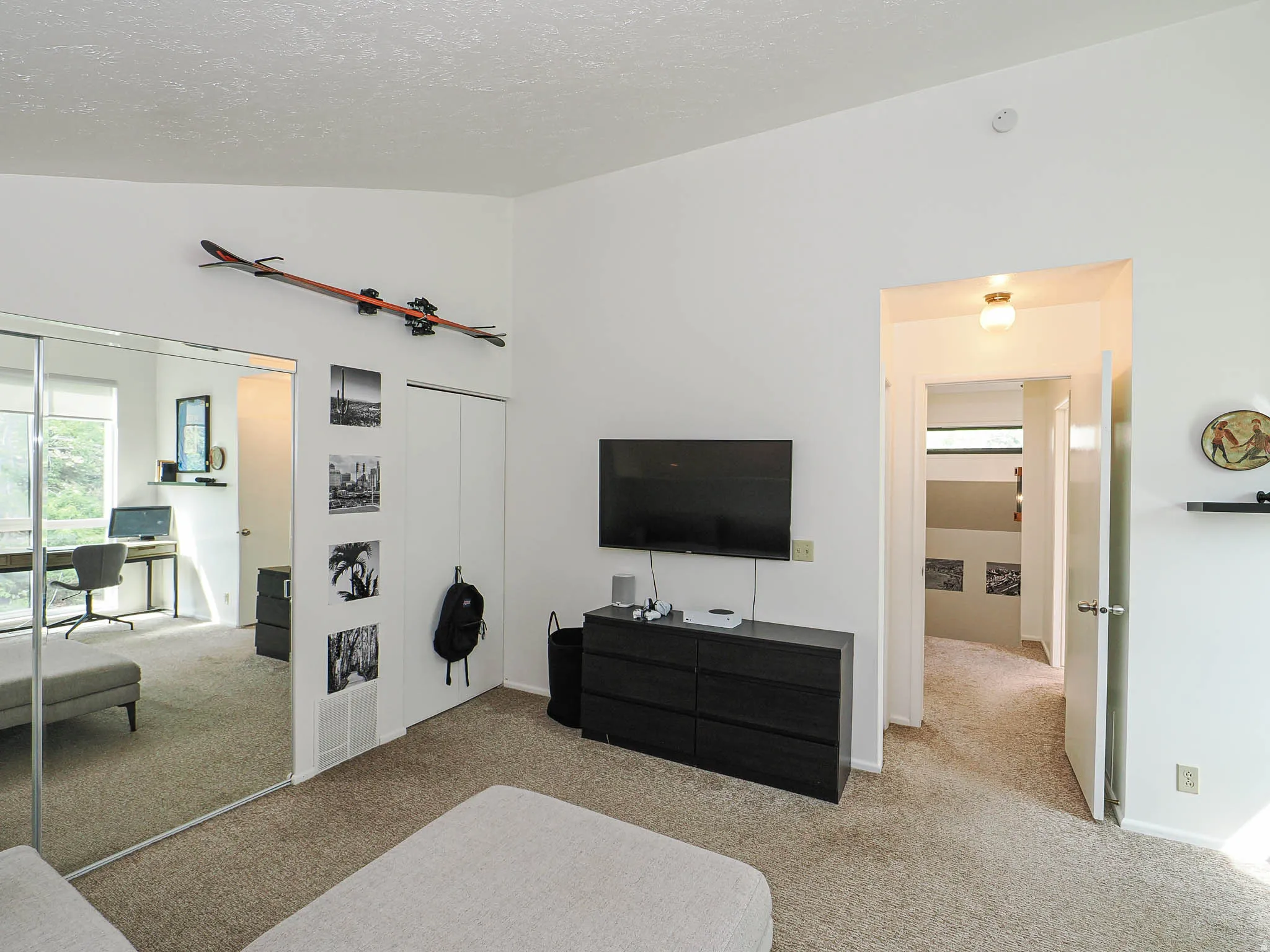Room featuring vaulted ceilings and neutral carpeting