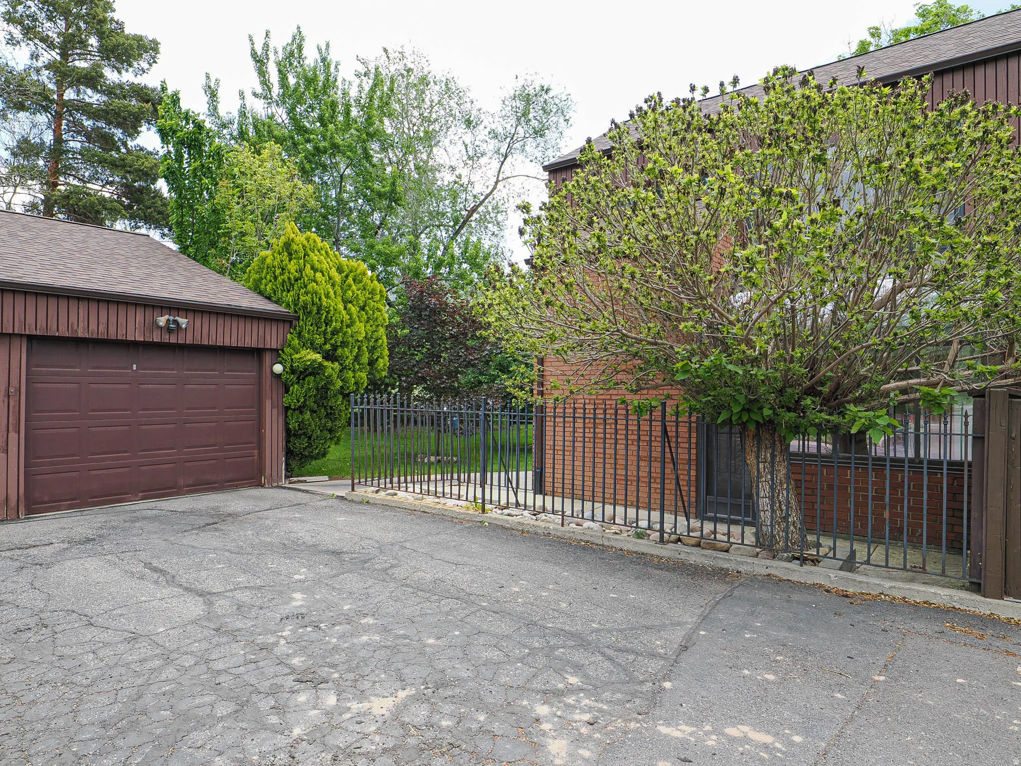 Detached garage with a brown panel door