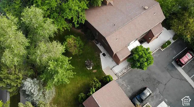 Sloped roofline structure with ample surrounding greenery
