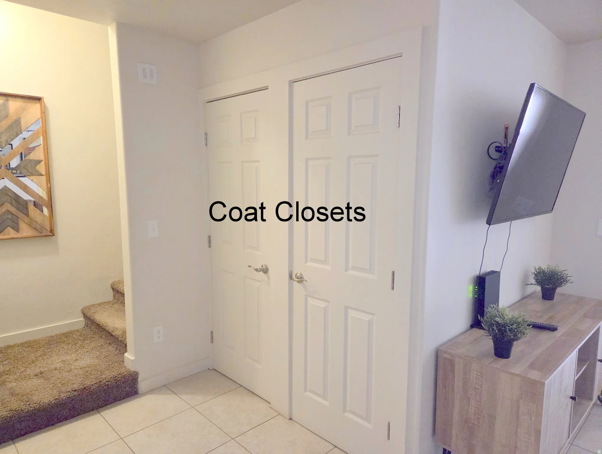 Two panel-style doors provide enclosed storage