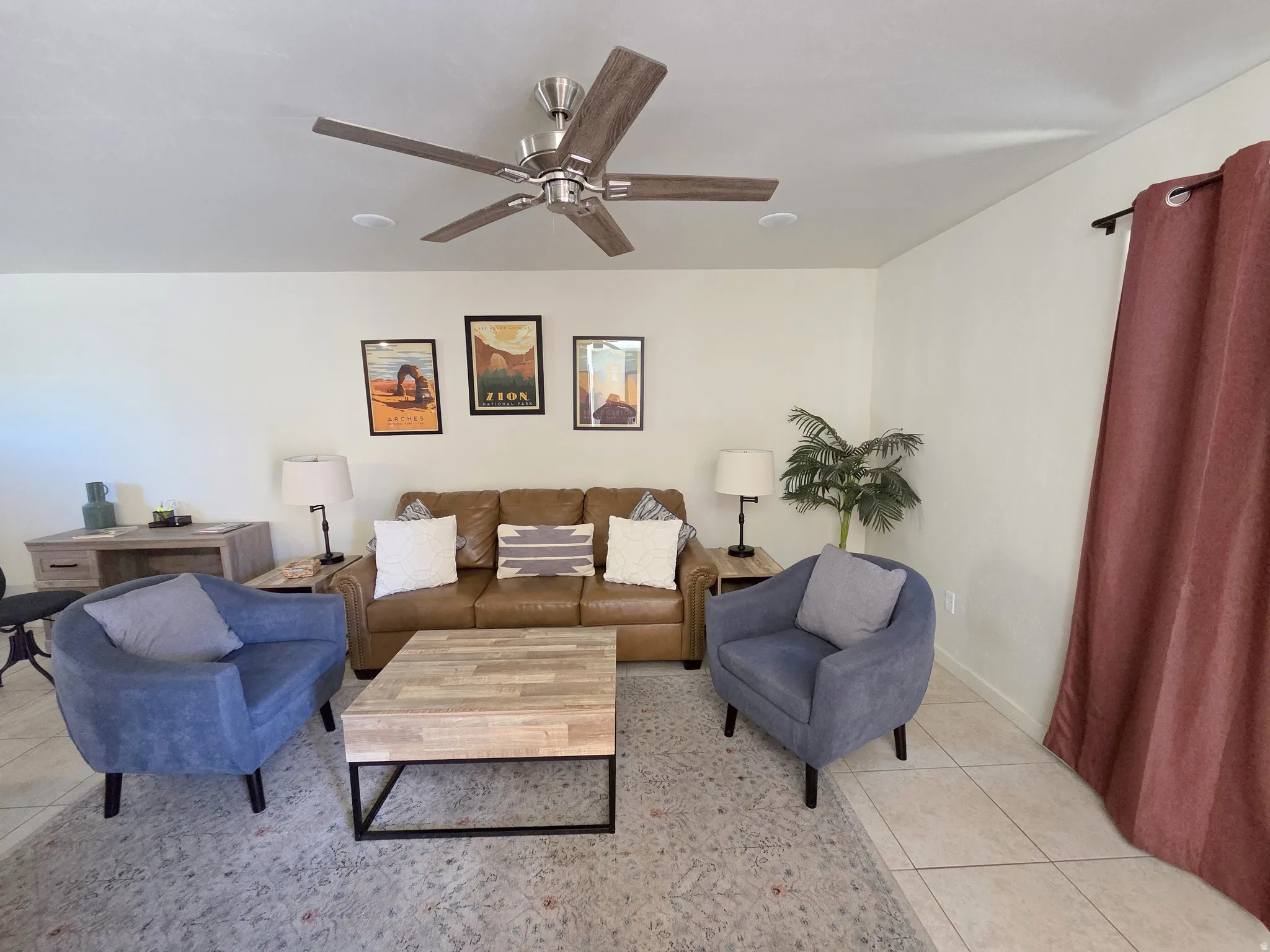 Living area featuring tile flooring, a ceiling fan with light, and recessed lighting