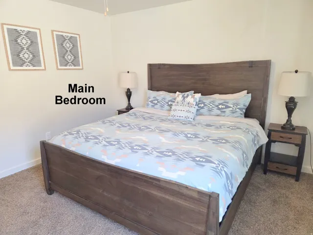 Carpeted bedroom with neutral wall tones