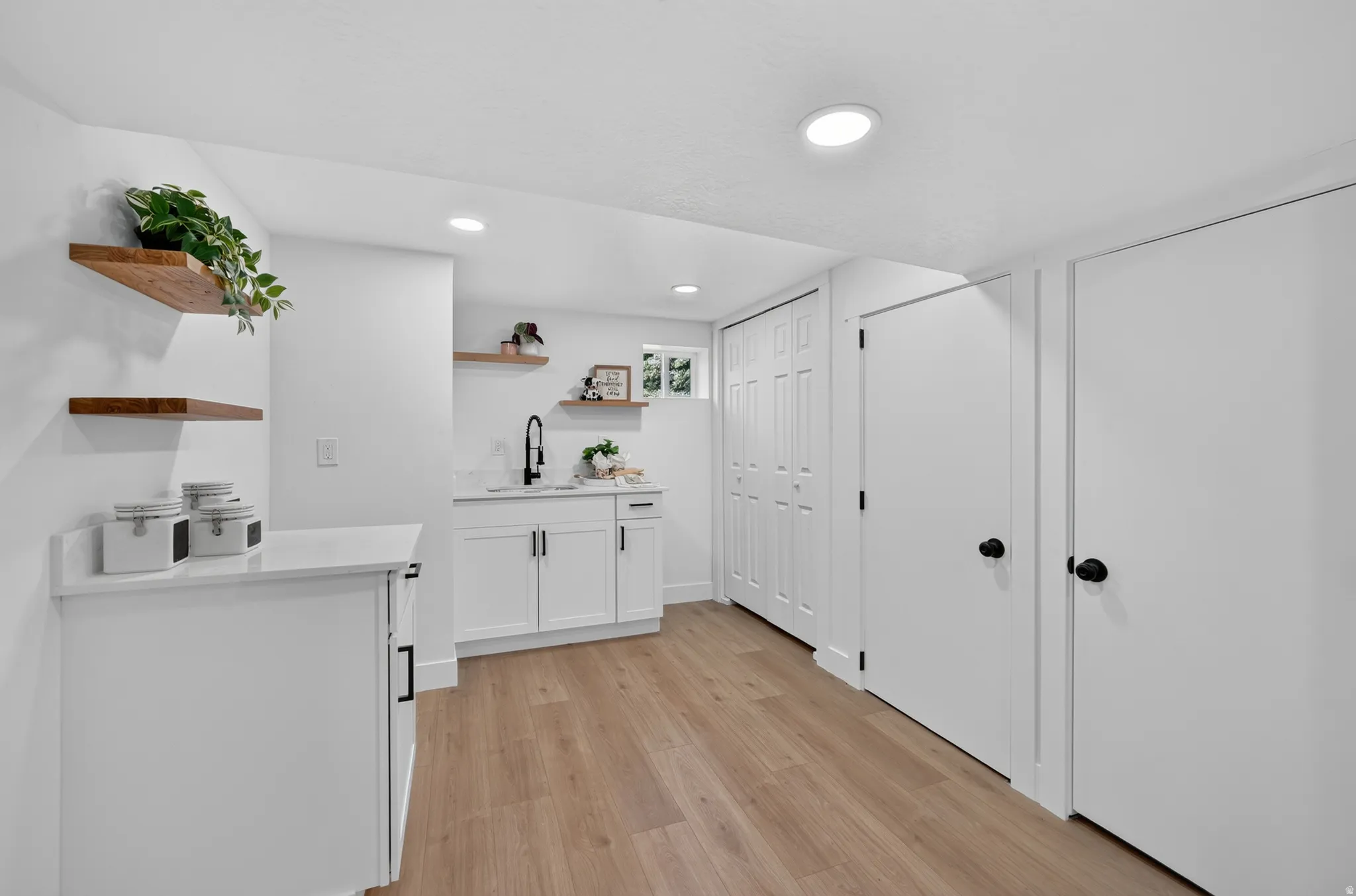 Bright interior with wood-finish flooring and recessed lighting