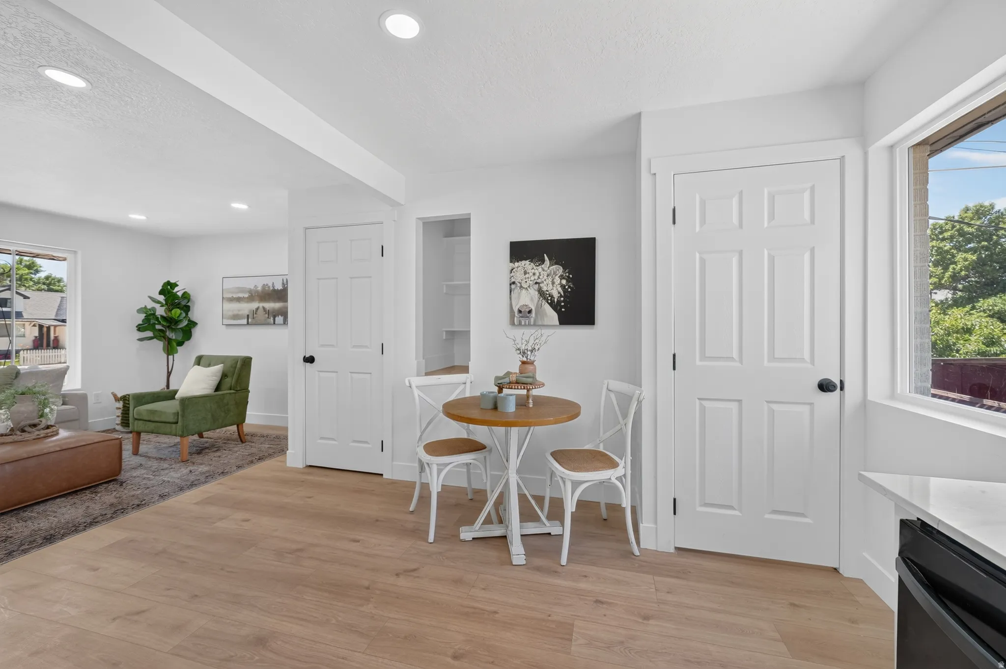 Contemporary interior with wood-finish flooring throughout