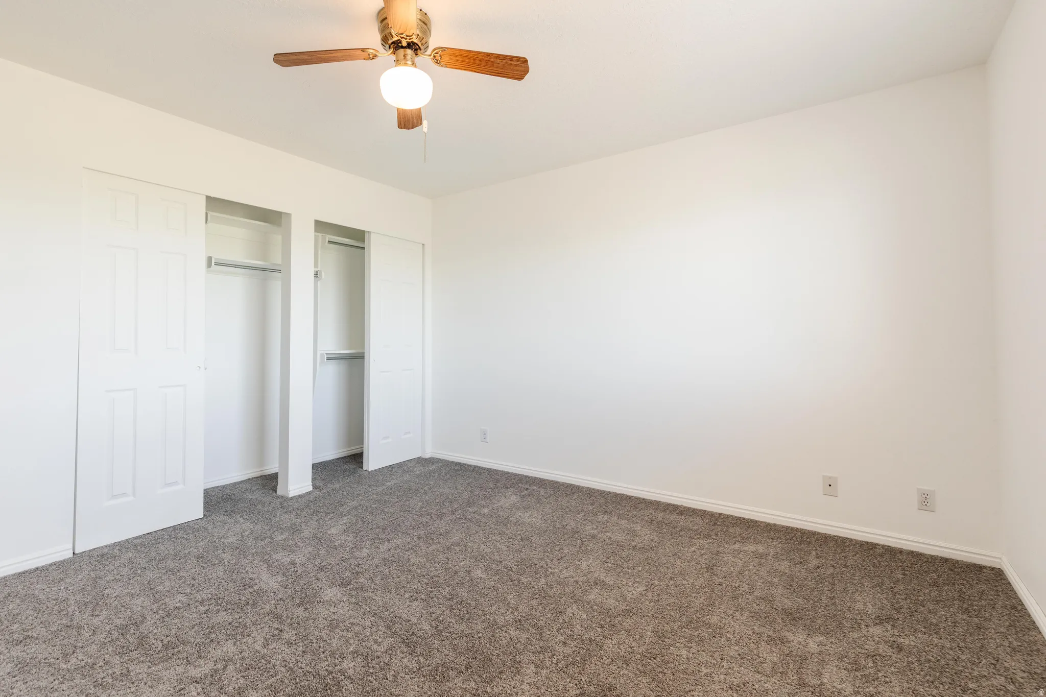 Neutral wall finishes with a ceiling fan light fixture