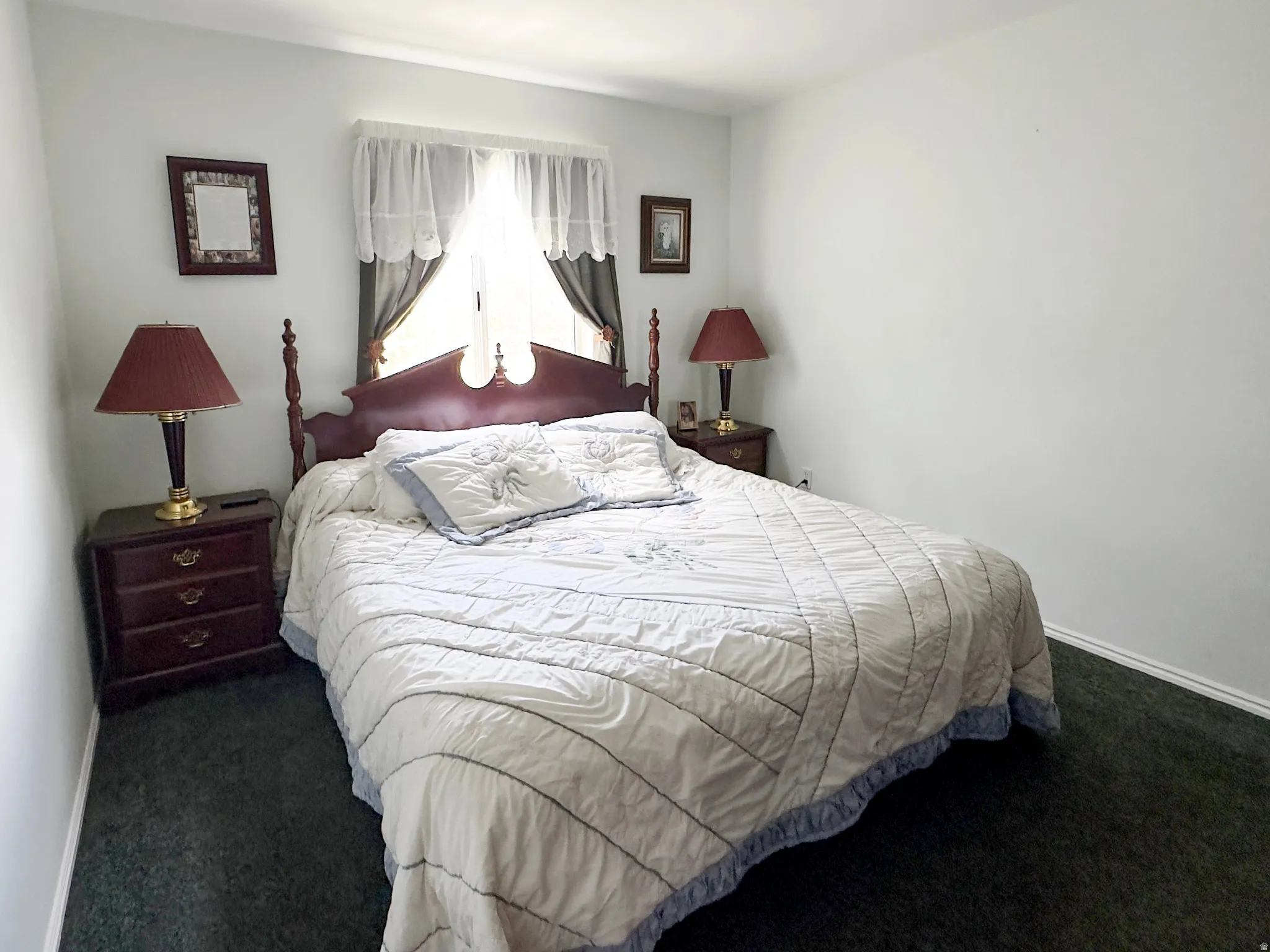 Bedroom featuring wall-to-wall carpeting and neutral wall tones