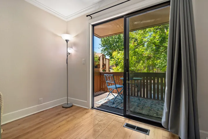 Glass sliding door to an outdoor balcony