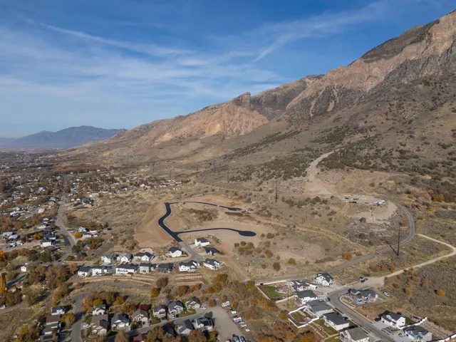 Expansive development site featuring graded lots and newly paved roads