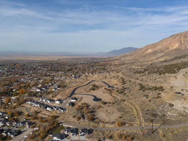 Aerial perspective showcasing a developing residential area with paved streets and cul-de-sacs