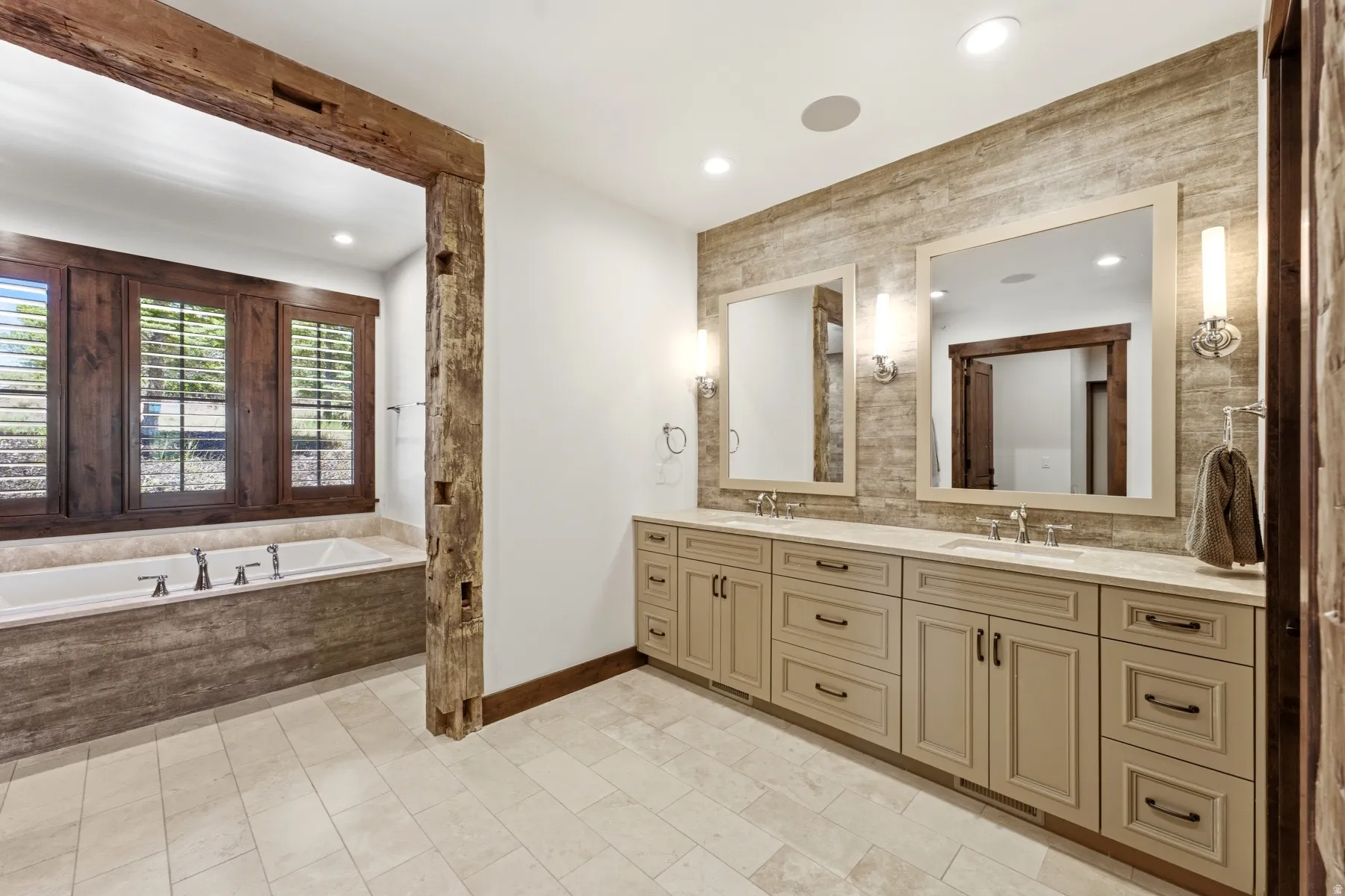 Dual vanity with light-toned cabinetry and integrated sinks