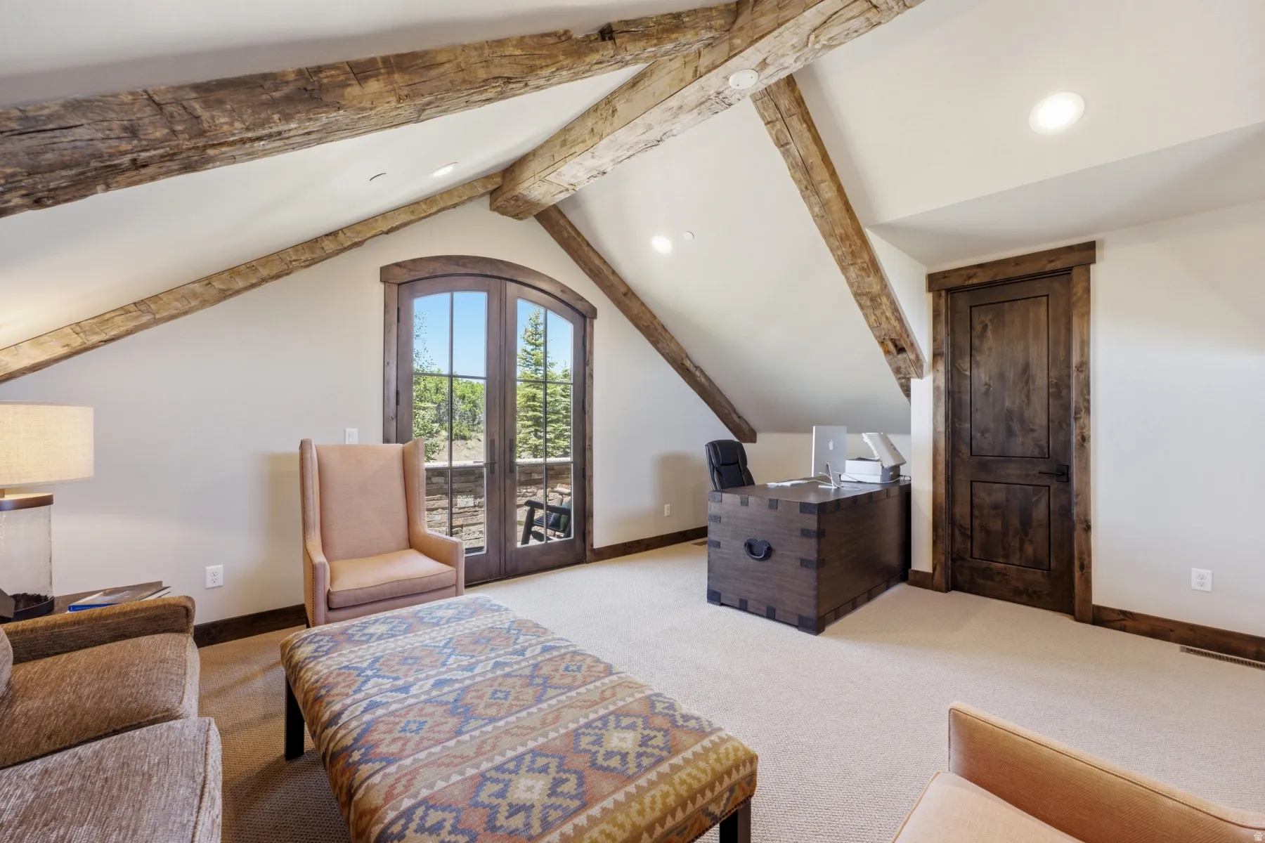 Vaulted ceilings featuring exposed wood beams