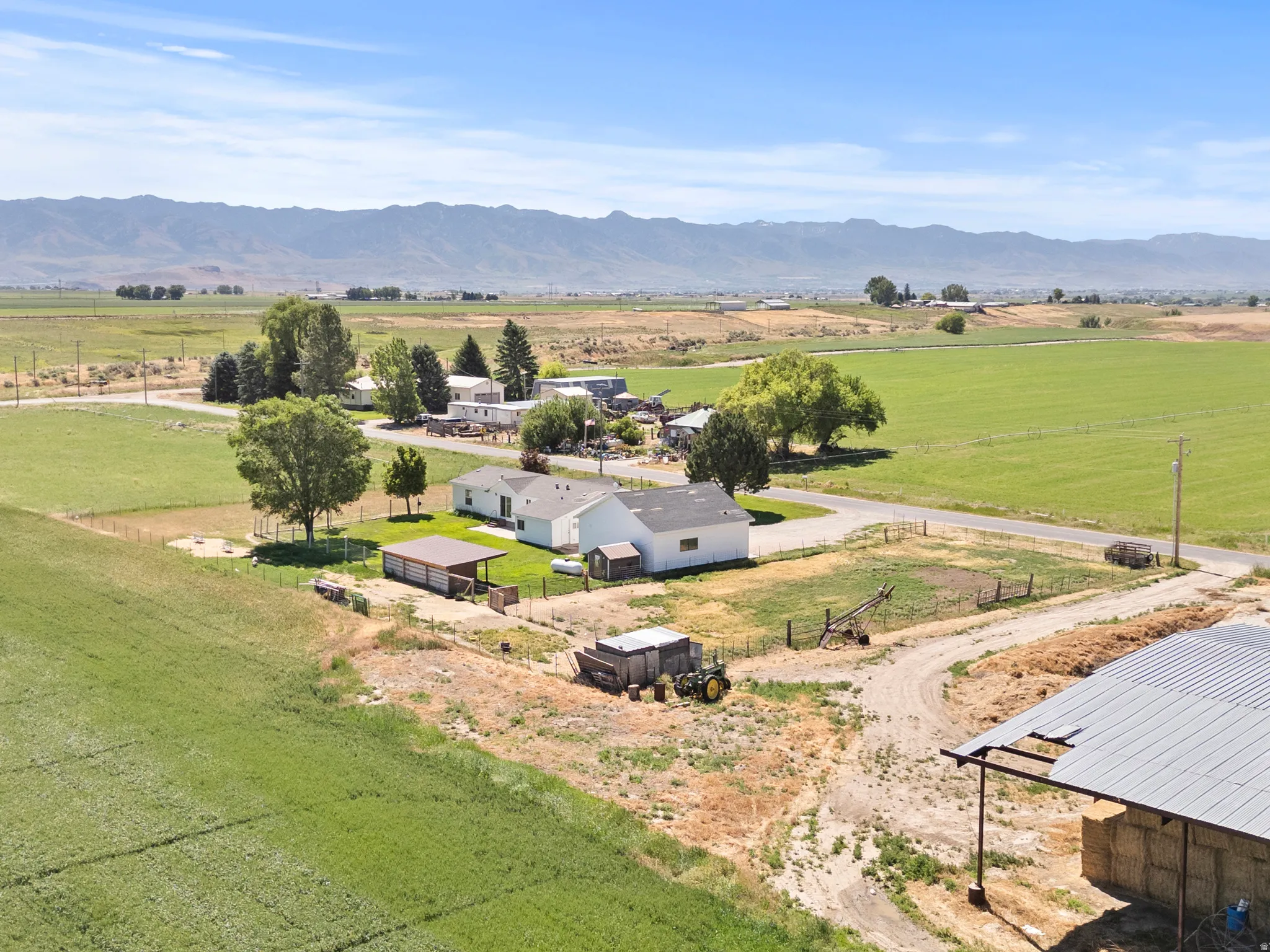 Expansive rural property featuring multiple structures and agricultural land