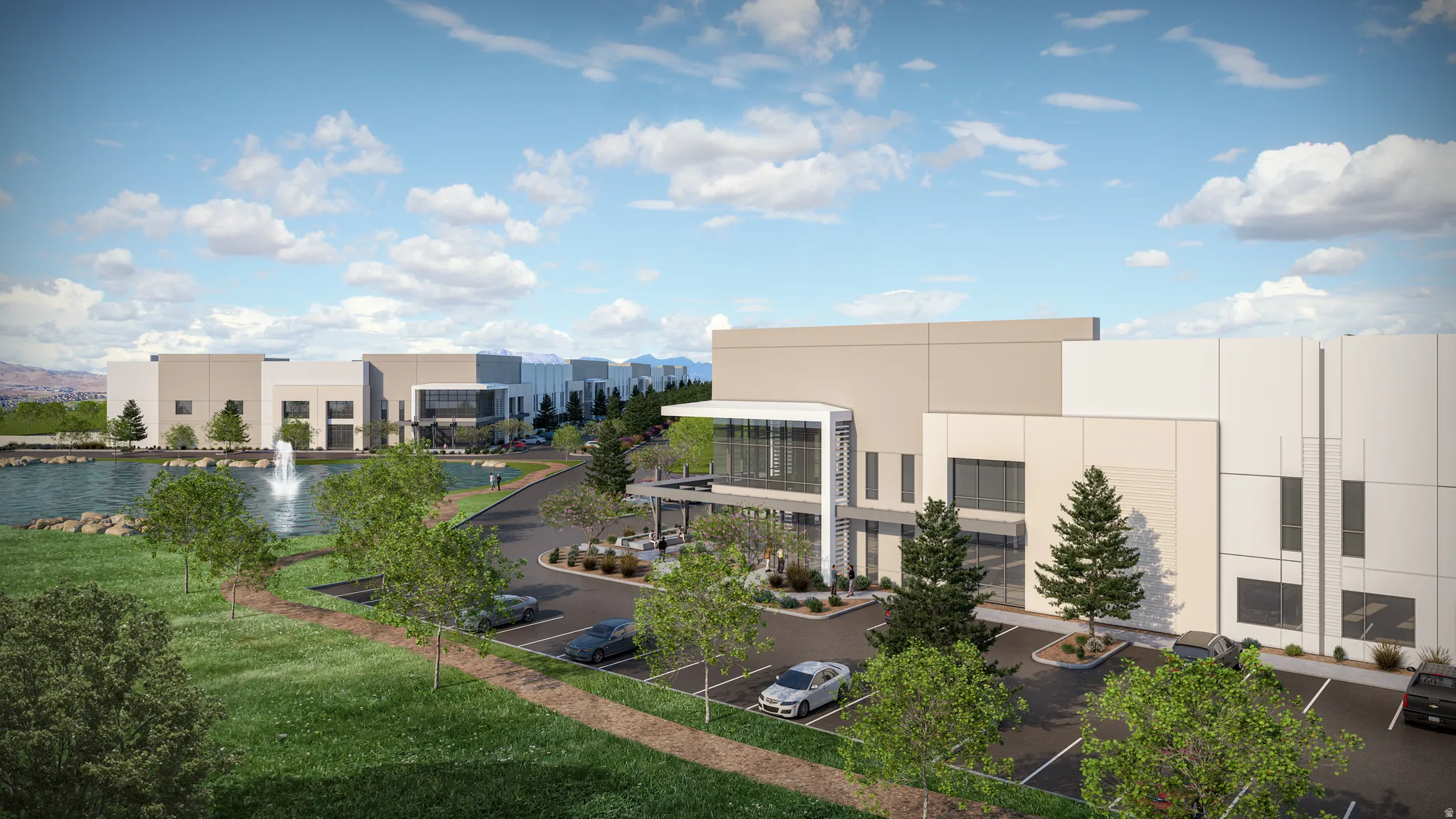 Modern industrial buildings featuring a contemporary facade, large window elements, and ample surface parking