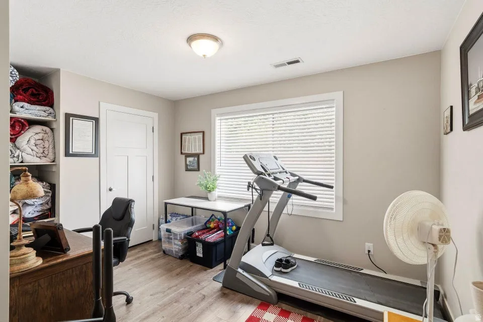 Neutral-toned walls with an overhead flush-mount light fixture